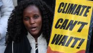 A demonstrator holds a placard during a protest on climate emergency called by environmental groups outside the UN Climate Change Conference COP25 in Madrid on December 13, 2019. AFP / Pierre-Philippe Marcou 