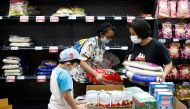 People stock up on rice after Singapore raised the coronavirus outbreak alert level to orange, at a supermarket in Singapore February 8, 2020. REUTERS/Edgar Su