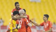 Al Arabi SC players celebrate their win over Al Khor in the Amir Cup Round of 16 match at Al Gharafa Stadium yesterday.