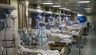 Medical workers in protective suits attend to novel coronavirus patients at the intensive care unit (ICU) of a designated hospital in Wuhan, Hubei province, China February 6, 2020. Picture taken February 6, 2020.