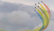 Members of the Chinese People's Liberation Army Air Force's Bayi Aerobatic Team fly J-10 performance aircraft as they take part in an aerial display during a media preview ahead of the Singapore Airshow in Singapore on February 9, 2020. / AFP / ROSLAN RAH