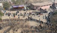 People queue at a polling station to cast their votes during the Legislative Assembly elections in New Delhi on February 8, 2020. / AFP / Sajjad HUSSAIN