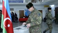 Azerbaijan's servicemen vote at a polling station during the parliamentary elections in Baku on February 9, 2020. AFP / Tofik Babayev 