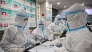  This file photo taken on January 25, 2020 shows medical staff members wearing protective clothing to help stop the spread of a deadly virus which began in the city as they work at the Wuhan Red Cross Hospital in Wuhan