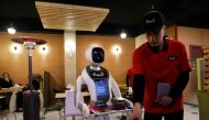 A waitress robot (Timea) delivers food to a table at the Times Fast Food restaurant in Kabul, Afghanistan February 11, 2020.REUTERS/Mohammad Ismail