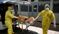 Health workers wearing protective gear take part in an exercise in handling a suspected patient at Sanglah hopital in Denpasar, Indonesia's resort island of Bali, on February 12, 2020. The number of fatalities from China's COVID-19 coronavirus epidemic ju