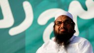 FILE PHOTO: Hafiz Muhammad Saeed, chief of the banned Islamic charity Jamat-ud-Dawa, looks over the crowed as they end a 