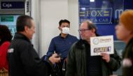 A traveler wears a mask in light of the coronavirus outbreak in China after landing at Benito Juarez international airport in Mexico City, January 24, 2020. Reuters / Carlos Jasso
