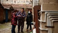 Members of a neighbourhood committee register a local and ask about his travel history in Jiujiang, Jiangxi province, China as the country is hit by coronavirus, February 2, 2020. Reuters / Thomas Peter