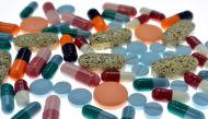 Pharmaceutical tablets and capsules are arranged on a table in a photo illustration shot September 18, 2013. Reuters/Srdjan Zivulovic
 