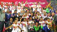 Zamalek's players and officials celebrate with the trophy after winning the CAF Super Cup final against Tunisia’s Esperance at Thani Bin Jassim Stadium in Doha, yesterday.