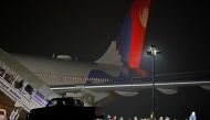 Nepalese nationals who were in the coronavirus-stricken Chinese city of Wuhan walk out from a Nepal Airlines plane carrying 175 Nepalese nationals, before they were sent to be quarantine, at Tribhuvan International Airport in Kathmandu, Nepal February 16,