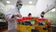 Workers arrange food packages at Mychef halal food factory in Kuala Lumpur, Malaysia, December 6, 2019. Picture taken December 6, 2019. REUTERS/Lim Huey Teng
