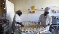 Workers produce sweet potato products at a processing factory in Maua, Meru County, Kenya, January 26, 2020. Thomson Reuters Foundation/Caroline Wambui