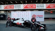 Formula One F1 - Pre Season Testing - Circuit de Barcelona-Catalunya, Barcelona, Spain - February 19, 2020 Haas' Kevin Magnussen and Romain Grosjean pose with the new car REUTERS/Albert Gea