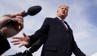 U.S. President Donald Trump talks to reporters prior to boarding Air Force One as he departs Washington for campaign travel to California from Joint Base Andrews in Maryland, U.S., February 18, 2020. REUTERS/Kevin Lamarque