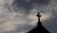 Storm clouds pass over a Roman Catholic church in Pittsburgh, Pennsylvania, US, August 14, 2018. Reuters / Jason Cohn