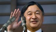 Japan's Emperor Naruhito waving to well-wishers during a New Year's greeting ceremony at the Imperial Palace in Tokyo. AFP / Kazuhiro NOGI