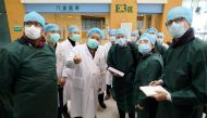 Experts from China and the World Health Organization (WHO) joint team wearing face masks visit the Wuhan Tongji Hospital in Wuhan, the epicentre of the novel coronavirus outbreak, in Hubei province, China February 23, 2020. China Daily via REUTERS 