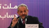 Afghanistan's Health Minister Ferozuddin Feroz gestures as he speaks during a press conference in Kabul on February 24, 2020./ AFP / WAKIL KOHSAR 