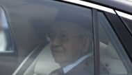 Malaysia’s former prime minister Mahathir Mohamad looks on as he leaves the National Palace in Kuala Lumpur on February 24, 2020.  AFP / Mohd RASFAN