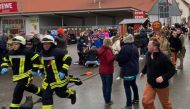 People react at the scene after a car ploughed into a carnival parade injuring several people in Volkmarsen, Germany February 24, 2020. Elmar Schulten/Waldeckische Landeszeitung via Reuters. 