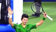 Serbia's Novak Djokovic greets the public after defeating Tunisia's Malek Jaziri during round 1 of the Dubai Duty Free Tennis Championships in the United Arab Emirates, on February 24, 2020.  AFP / Karim Sahib
