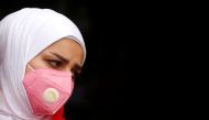 A demonstrator wears protective face mask, following the outbreak of the new coronavirus during ongoing anti-government protests in Baghdad, Iraq February 25, 2020. Reuters/Wissm al-Okili 
 