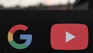 In this file photo taken on November 21, 2019, the Google and YouTube logos are seen at the entrance to the Google offices in Los Angeles, California. AFP / Robyn Beck