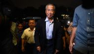 Muhyiddin Yassin (C), president of Parti Pribumi Bersatu Malaysia or Malaysian United Indigenous Party, arrives at the party headquarters in Kuala Lumpur on February 24, 2020. AFP / Mohd Rasfan  