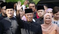 Malaysia's Prime Minister Designate and former interior minister Muhyiddin Yassin waves to reporters before his inauguration as the 8th prime minister, outside his residence in Kuala Lumpur, Malaysia, March 1, 2020. REUTERS/Lim Huey Teng