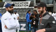 New Zealand captain Kane Williamson (R) talks to India captain Virat Kohli after New Zealand won the Test series on day three of the second Test cricket match between New Zealand and India at the Hagley Oval in Christchurch on March 2, 2020. / AFP / PETER