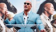  FILE PHOTO: Actor Dwayne Johnson speaks during a ceremony for actor Kevin Hart to place his handprints and footprints in cement in the forecourt of the TCL Chinese theatre in Los Angeles, California, U.S., December 10, 2019. REUTERS/Mario Anzuoni/File Ph