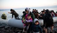Migrants from Afghanistan arrive on a dinghy on a beach near the village of Skala Sikamias, after crossing part of the Aegean Sea from Turkey to the island of Lesbos, Greece, March 2, 2020. Reuters/Alkis Konstantinidis