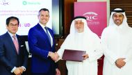 Khalifa Abdulla Turki Al Subaey (second right), the Group President of QIC Group;  Salem Al Mannai, Group CEO (right); along with the senior officials of Swiss Re, at QIC headquarters in Doha, on Sunday. 
