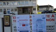 A board set outside of the Bertrand Du Guesclin high school informs the temporary closure of the schools in the area, on March 2, 2020 in Auray, western France , as part of measures against the outbreak of the Covid-19 Coronavirus.
/ AFP / Damien MEYER