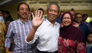 Malaysia's former interior minister Muhyiddin Yassin (C), his wife Noraini Abdul Rahman talk to the press outside his home in Kuala Lumpur on February 29, 2020. AFP / Mohd Rasfan    
 