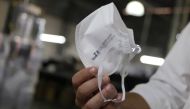 A man holds a PFF2 respirator mask at Delta Plus plant in Socorro, Sao Paulo state, Brazil March 3, 2020.  Reuters/Rahel Patrasso