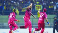 West Indies' Oshane Thomas (C) celebrates with his teammates after dismissing Sri Lanka's Angelo Mathews during the first Twenty20 international cricket match of a two-match series between Sri Lanka and West Indies at the Pallekele International Cricket S