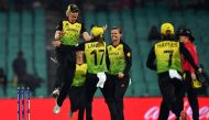 Australia's players celebrate after winning against South Africa during the Twenty20 women's World Cup semi-final cricket match between Australia and South Africa in Sydney on March 5, 2020. (AFP / Saeed KHAN)