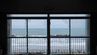  The ocean is seen through broken windows of a building which was damaged by the March 11, 2011 earthquake and tsunami in Futaba Town, near tsunami-crippled Fukushima Daiichi nuclear power plant, Fukushima Prefecture, Japan February 17, 2020. Picture take