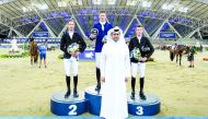 The President of Qatar and Asian Equestrian Federations, Hamad Abdulrahman Al Attiyah posing for a photograph with the podium winners of the feature event at the Longines Arena At Al Shaqab, yesterday.