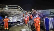 Rescuers work in the rubble of a collapsed hotel in Quanzhou, in China's eastern Fujian province on March 7, 2020. Around 70 people were trapped after the Xinjia Hotel collapsed on March 7 evening, officials said. / AFP / STR