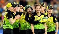 Australia's bowler Megan Schutt (2nd R) celebrates her wicket of India's Shikha Pandey with teammates during the Twenty20 women's World Cup cricket final match between Australia and India in Melbourne on March 8, 2020. / AFP / William WEST /