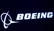 FILE PHOTO: The company logo for Boeing is displayed on a screen on the floor of the New York Stock Exchange (NYSE) in New York, U.S., March 11, 2019. REUTERS/Brendan McDermid