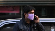 A man wears a face mask as a preventive measure following the coronavirus outbreak, as he talks on mobile phone in Peshawar, Pakistan March 10, 2020. Reuters/Fayaz Aziz
 