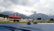 Ground staff work on the pitch ahead of the start of first one day international (ODI) cricket match of a three match series between India and South Africa, at the Himachal Pradesh Cricket Association Stadium in Dharamsala on March 12, 2020. 
/ AFP / Saj