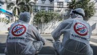 SAN JUAN, PHILIPPINES - MARCH 09: Workers wears hazmat suits as they disinfect and sanitize as precautionary measure against coronavirus at a public school in the City of San Juan in Philippines on March 09, 2020 ( DANTE DIOSINA JR - Anadolu Agency )

