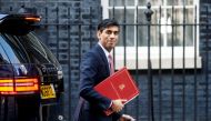 Britain's Chancellor of the Exchequer Rishi Sunak walks at Downing Street in London, Britain March 16, 2020. REUTERS/Henry Nicholls