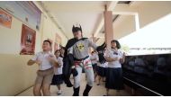 Thai teacher Worrawut Lakchai dressed as a batman sings and dances in fight against coronavirus disease (COVID-19) in Udon Thani province, Thailand in this screen grab obtained by Reuters from social media undated video, on March 18, 2020. YOUTUBE/HUGIDEA